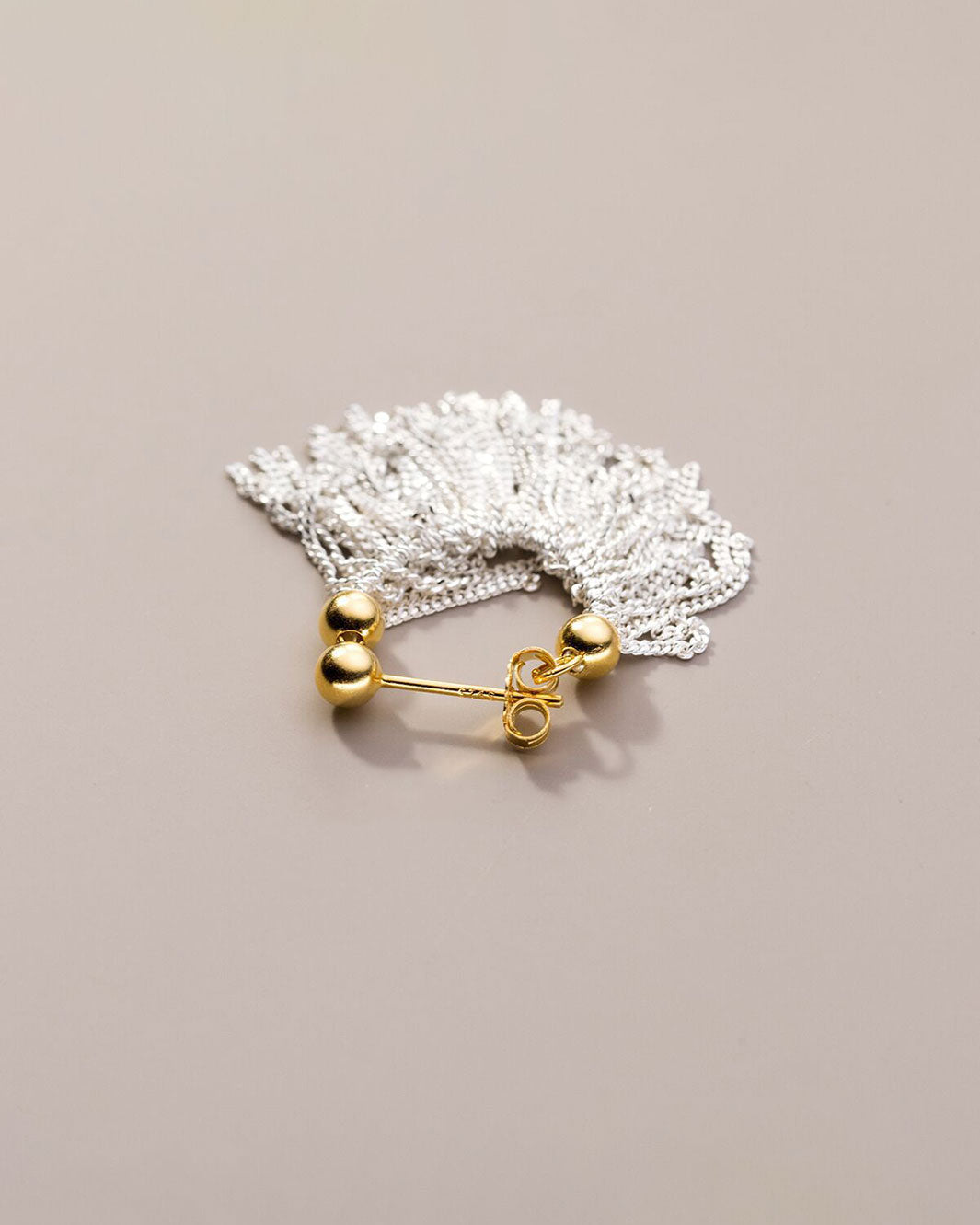 Dual Tone Gleaming Tassel Earrings