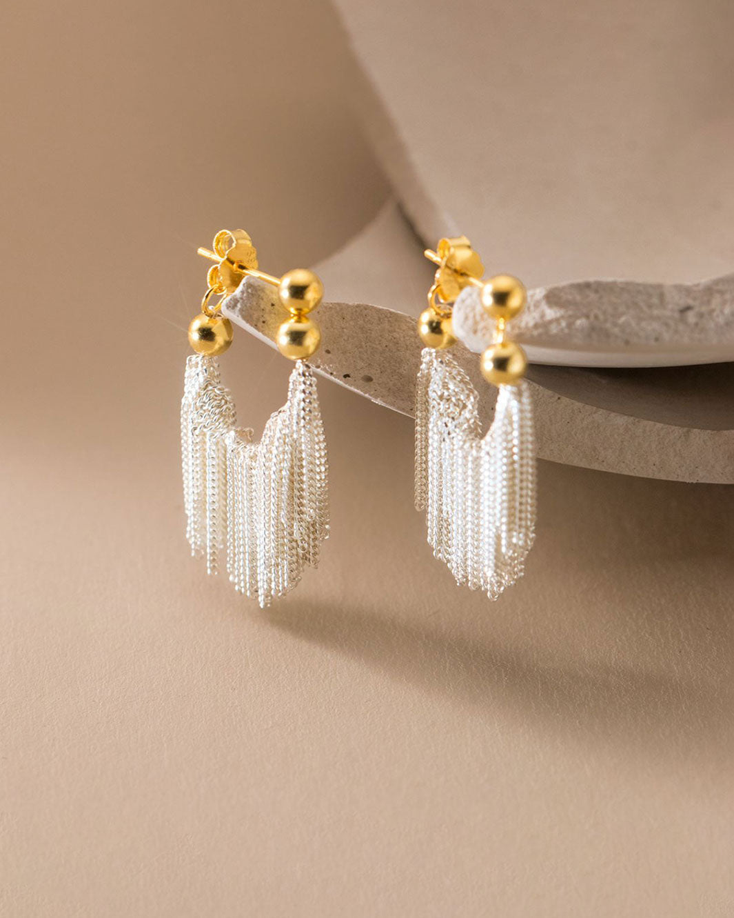 Dual Tone Gleaming Tassel Earrings