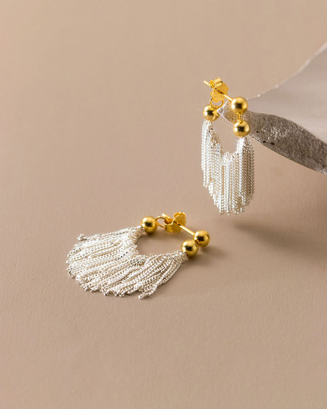 Dual Tone Gleaming Tassel Earrings