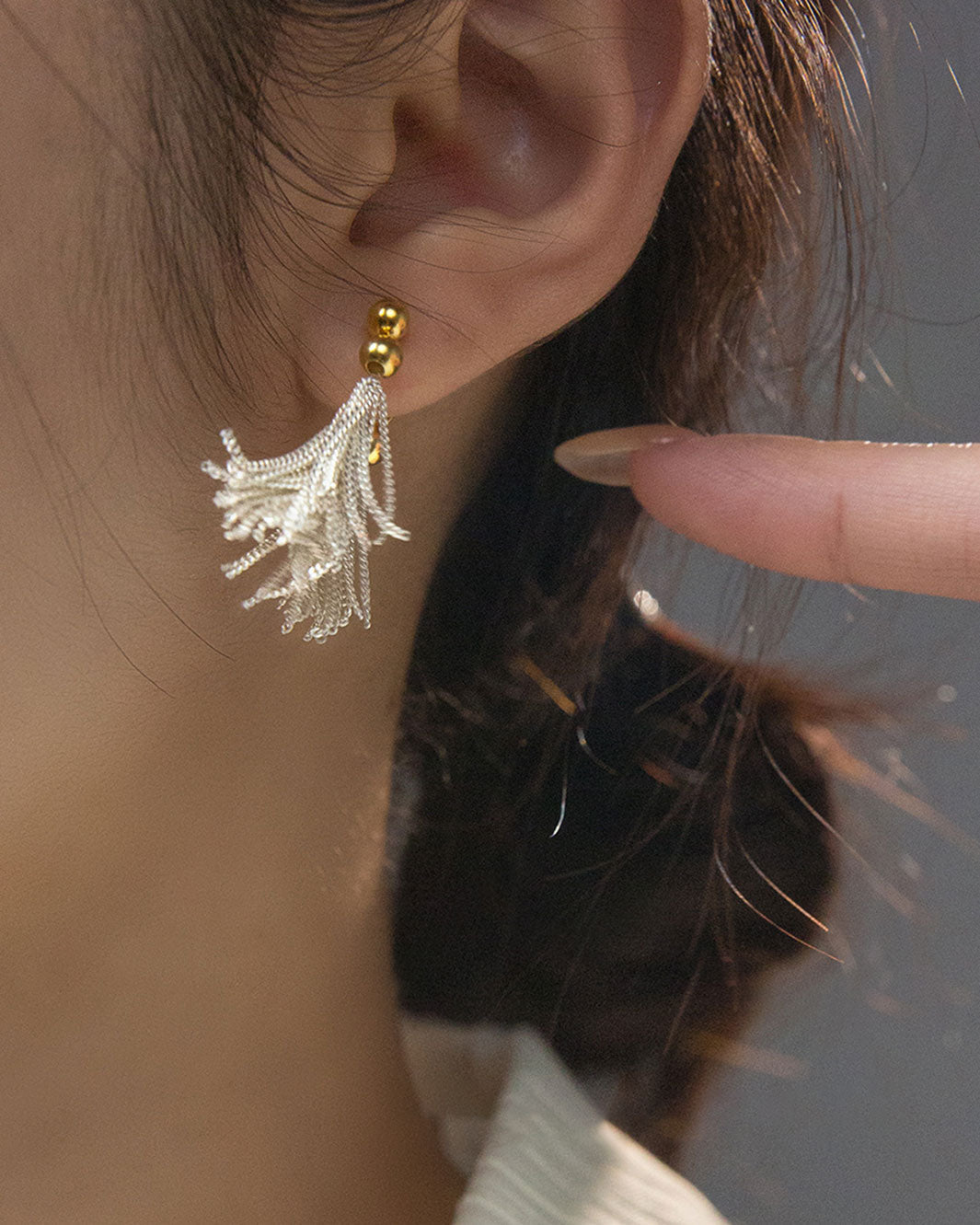 Dual Tone Gleaming Tassel Earrings