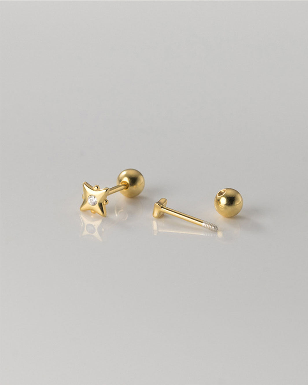 Tara Mismatch Star Barbell Earrings