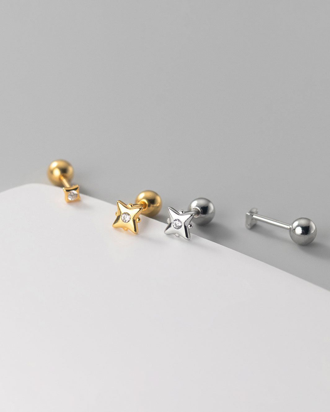 Tara Mismatch Star Barbell Earrings