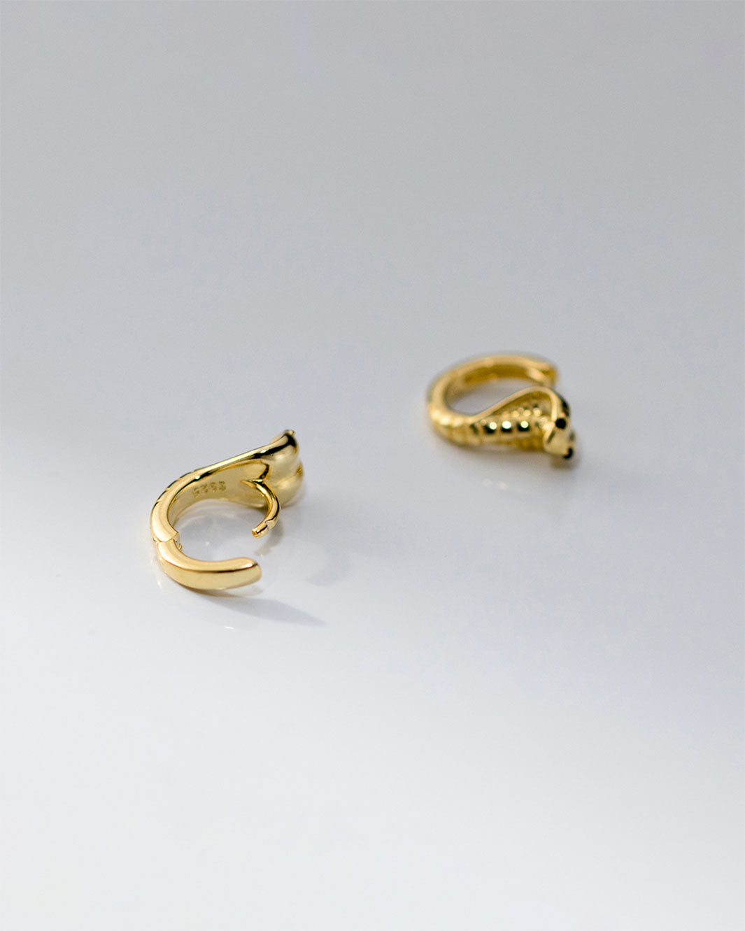 Black-Eyed Cobra Huggie Earrings