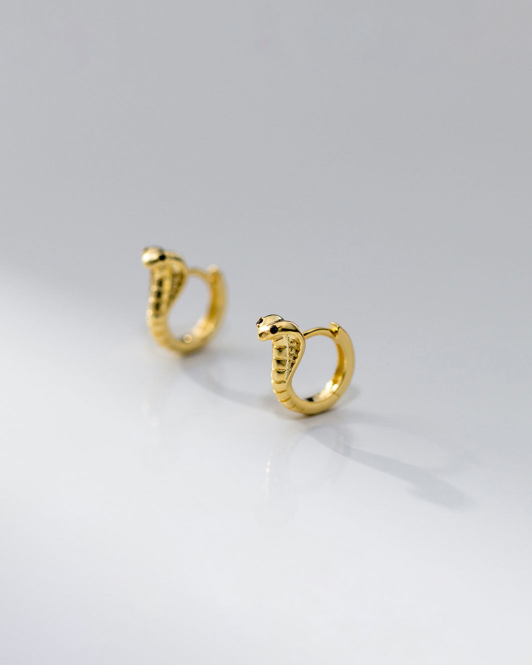 Black-Eyed Cobra Huggie Earrings