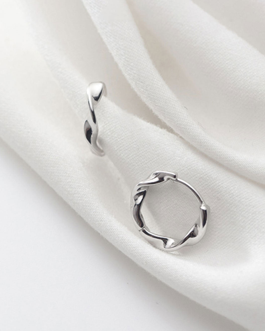 Elegant Swirl Huggie Earrings