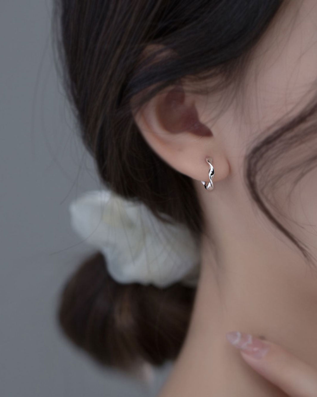 Elegant Swirl Huggie Earrings